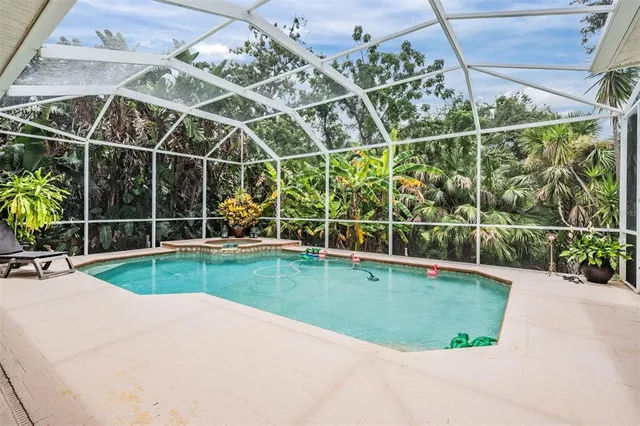 a view of a backyard with swimming pool
