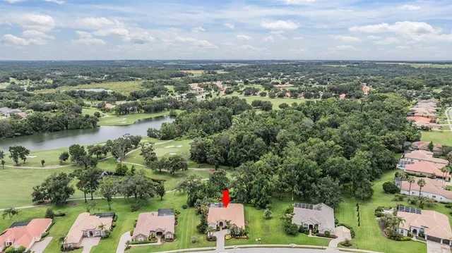 an aerial view of residential house with outdoor space and lake view
