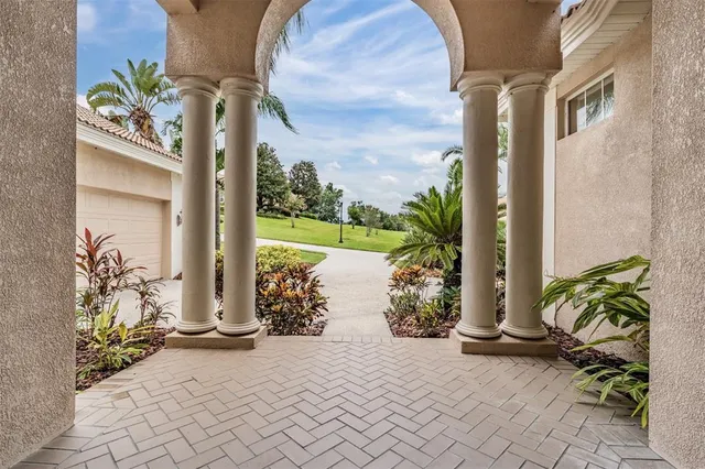 a view of a entryway with flower plants