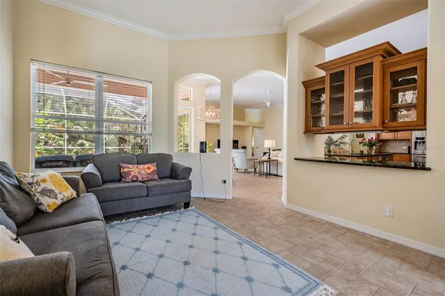 a living room with furniture and a large window
