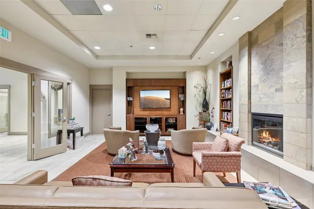a living room with fireplace furniture and a fireplace