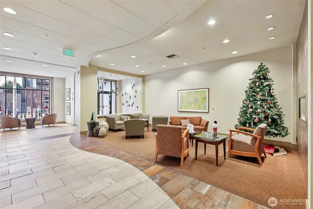 a living room with furniture potted plant and a window