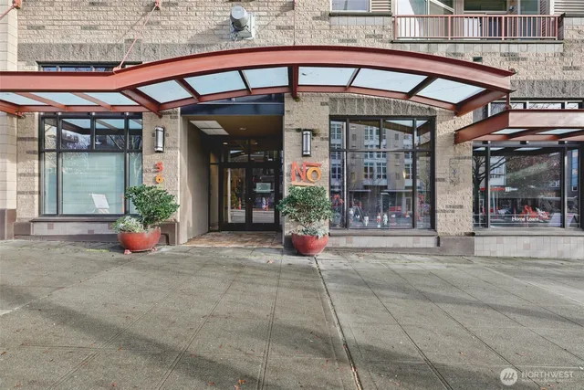 front view of a building with potted plants