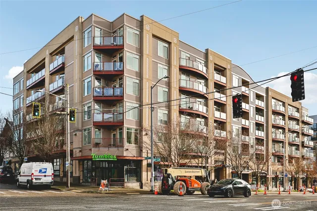 a city street lined with buildings and cars