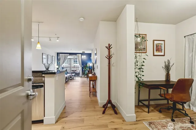 a view of a living room and kitchen view