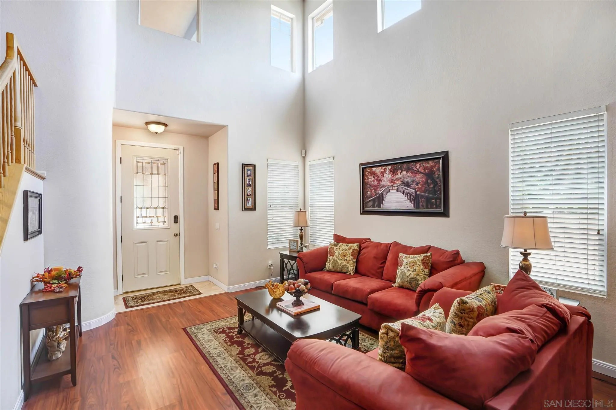 1266 Riviera Summit Road San Diego, CA 92154 - Photo 3 of 41 a living room with furniture and a wooden floor