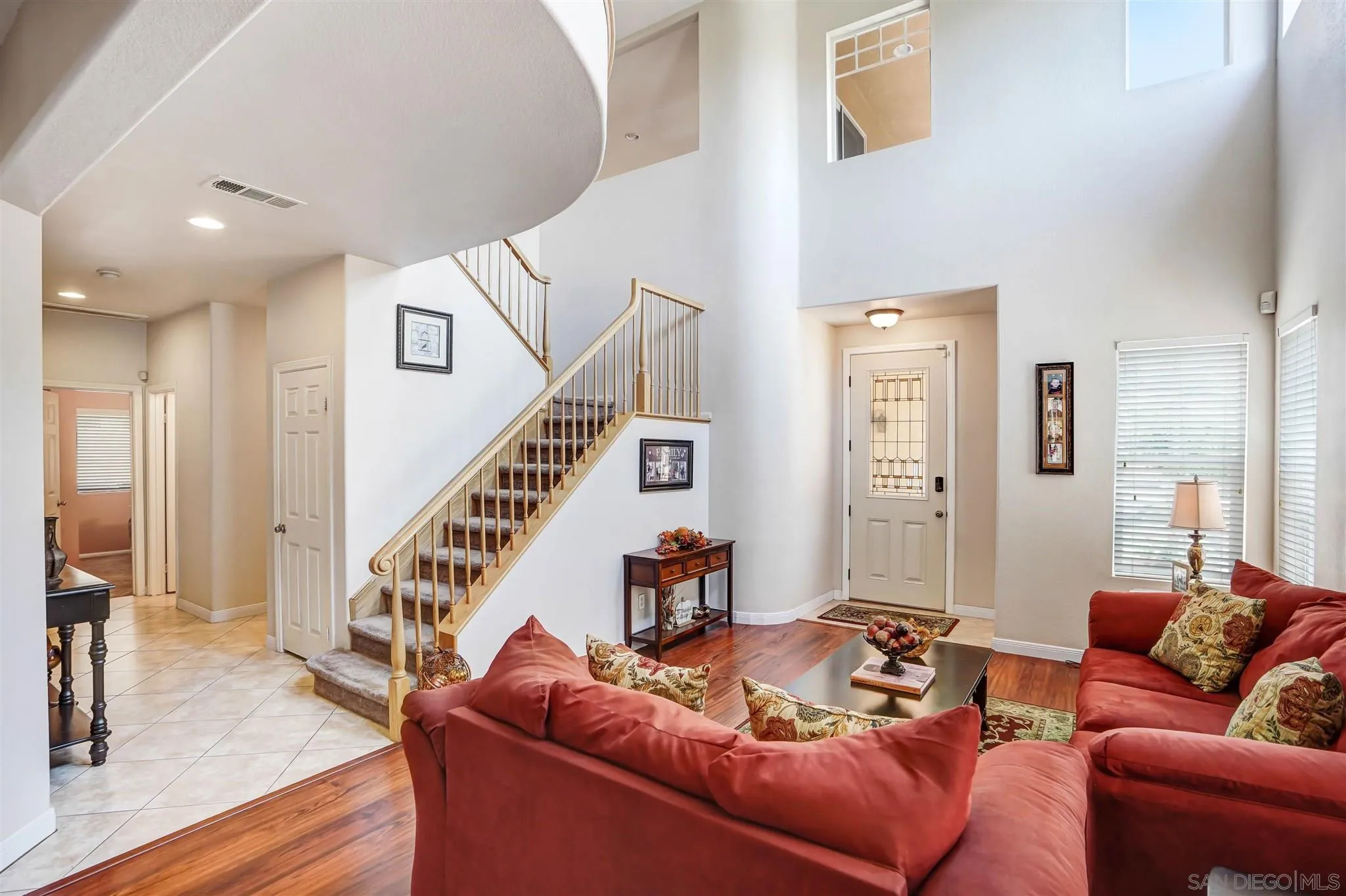 1266 Riviera Summit Road San Diego, CA 92154 - Photo 4 of 41 a living room with furniture and a wooden floor