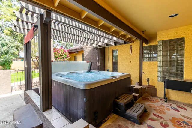 a view of balcony with a table and chairs