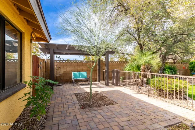 a row of palm trees in front of house