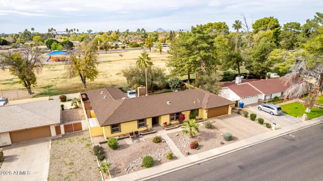 an aerial view of residential houses with outdoor space