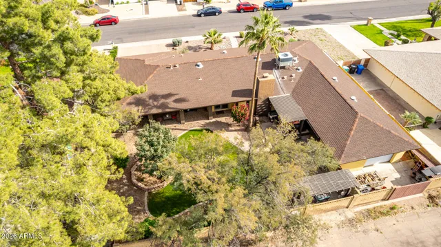 a view of a swimming pool with a yard