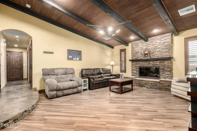 a living room with furniture and a fireplace