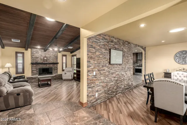 a view of a livingroom with furniture and a fireplace