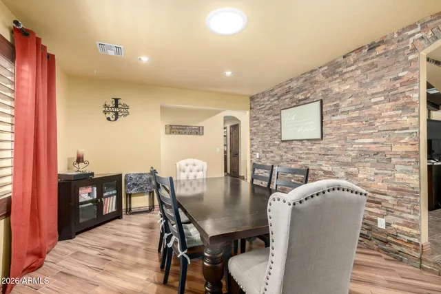 a dining room with furniture and window