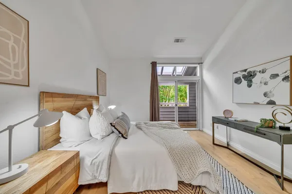 a bedroom with bed and window