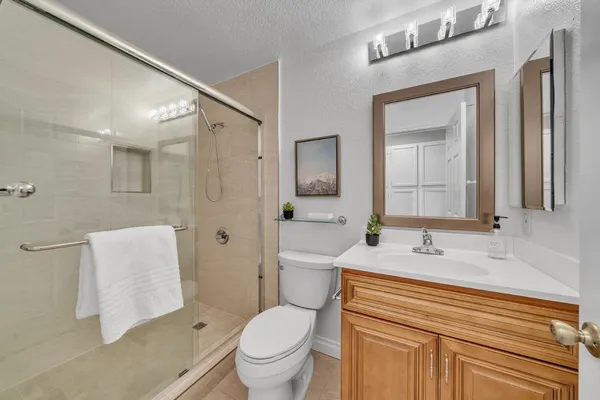 a bathroom with a shower and a toilet