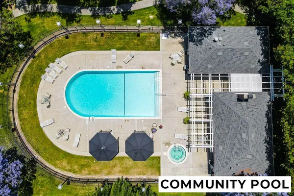 a view of a swimming pool with outdoor seating