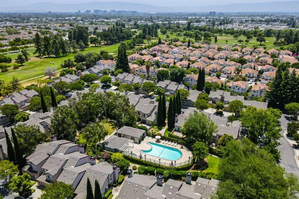 a view of a swimming pool with a patio