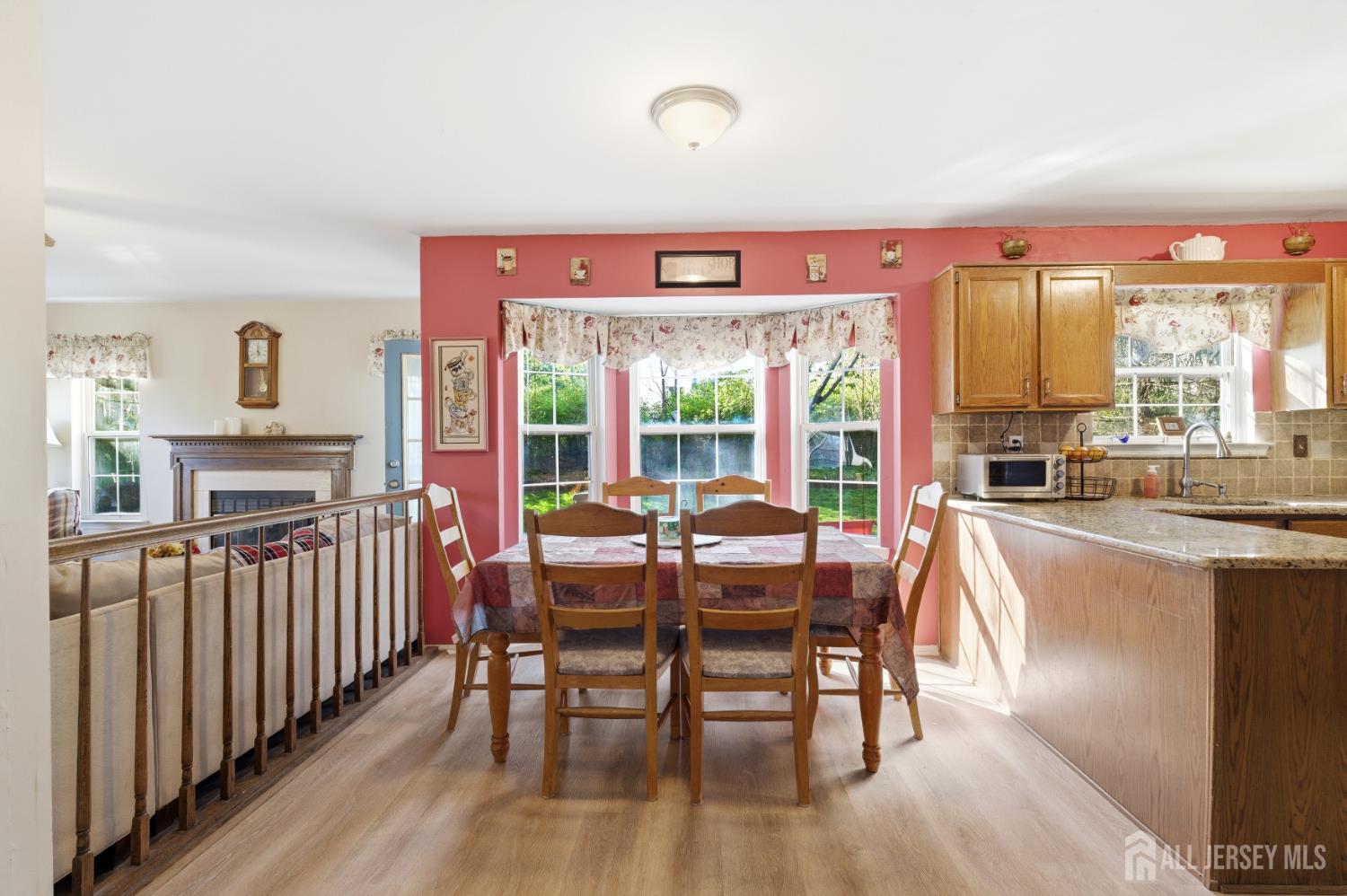 6 Shoshoni Way Somerville, NJ 08876 - Photo 17 of 52 a dining room with furniture a fireplace a rug and a large window
