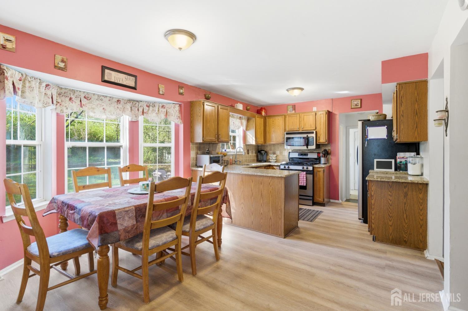 6 Shoshoni Way Somerville, NJ 08876 - Photo 19 of 52 a view of a dining room kitchen and windows