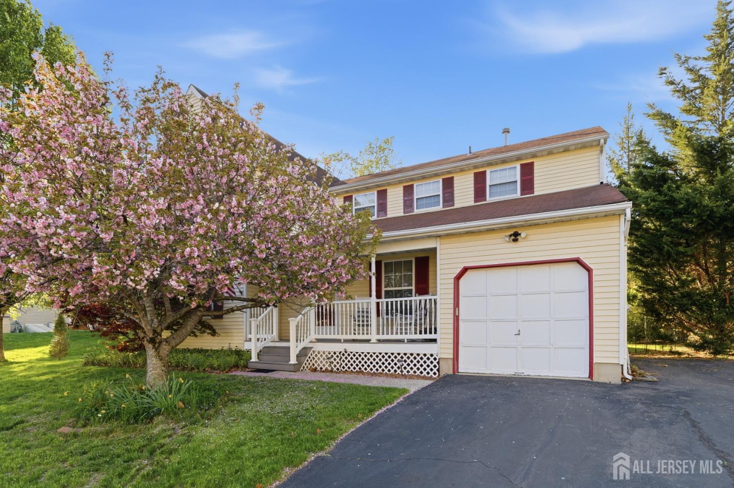 6 Shoshoni Way Somerville, NJ 08876 - Photo 2 of 52 a front view of a house with a garden and trees