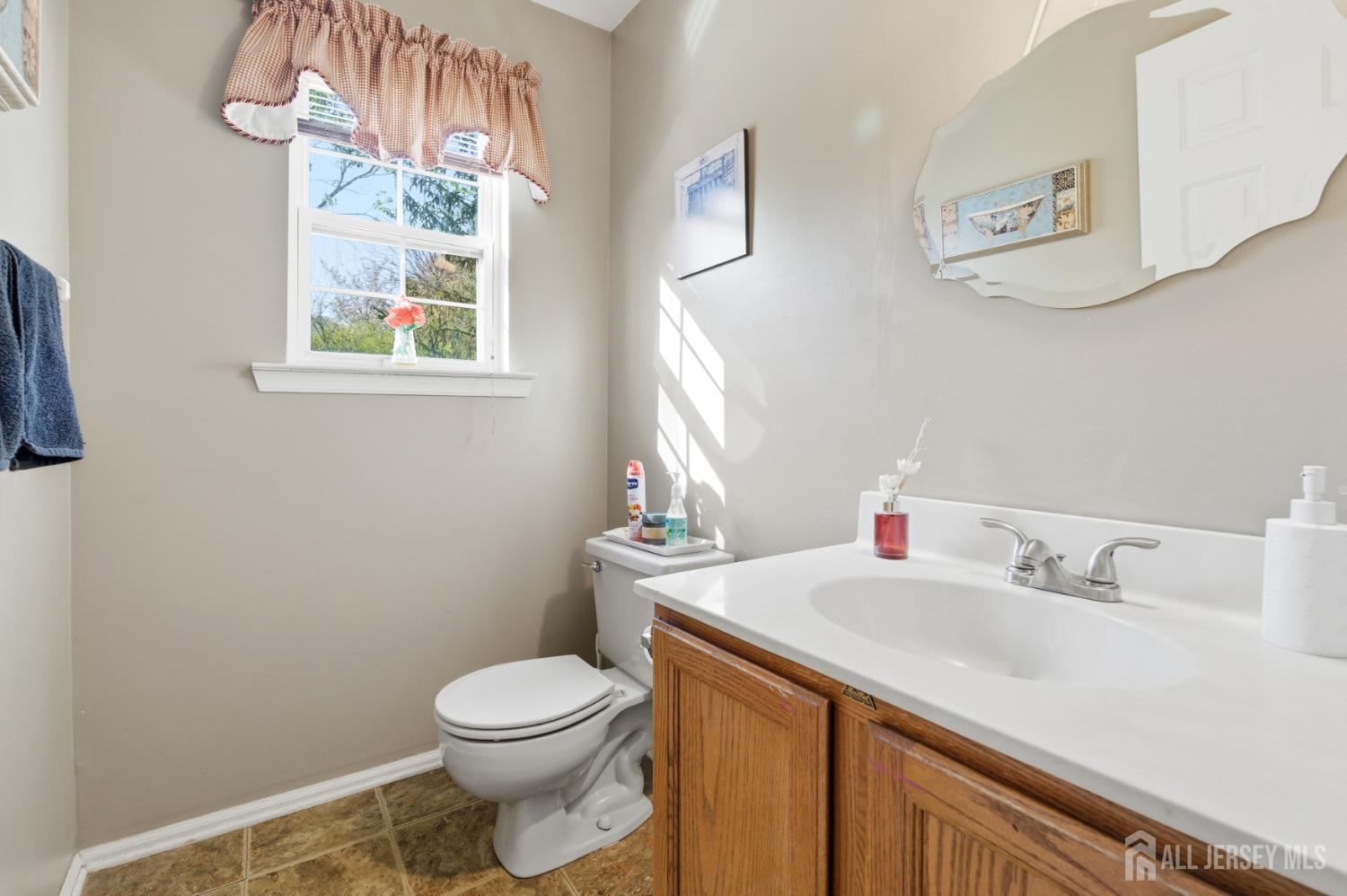 6 Shoshoni Way Somerville, NJ 08876 - Photo 22 of 52 a bathroom with a sink a toilet and a window