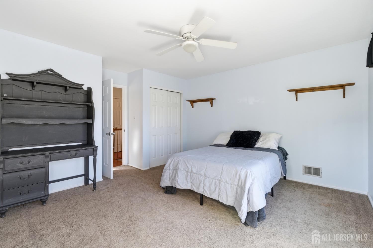 6 Shoshoni Way Somerville, NJ 08876 - Photo 24 of 52 a bedroom with a bed and a ceiling fan
