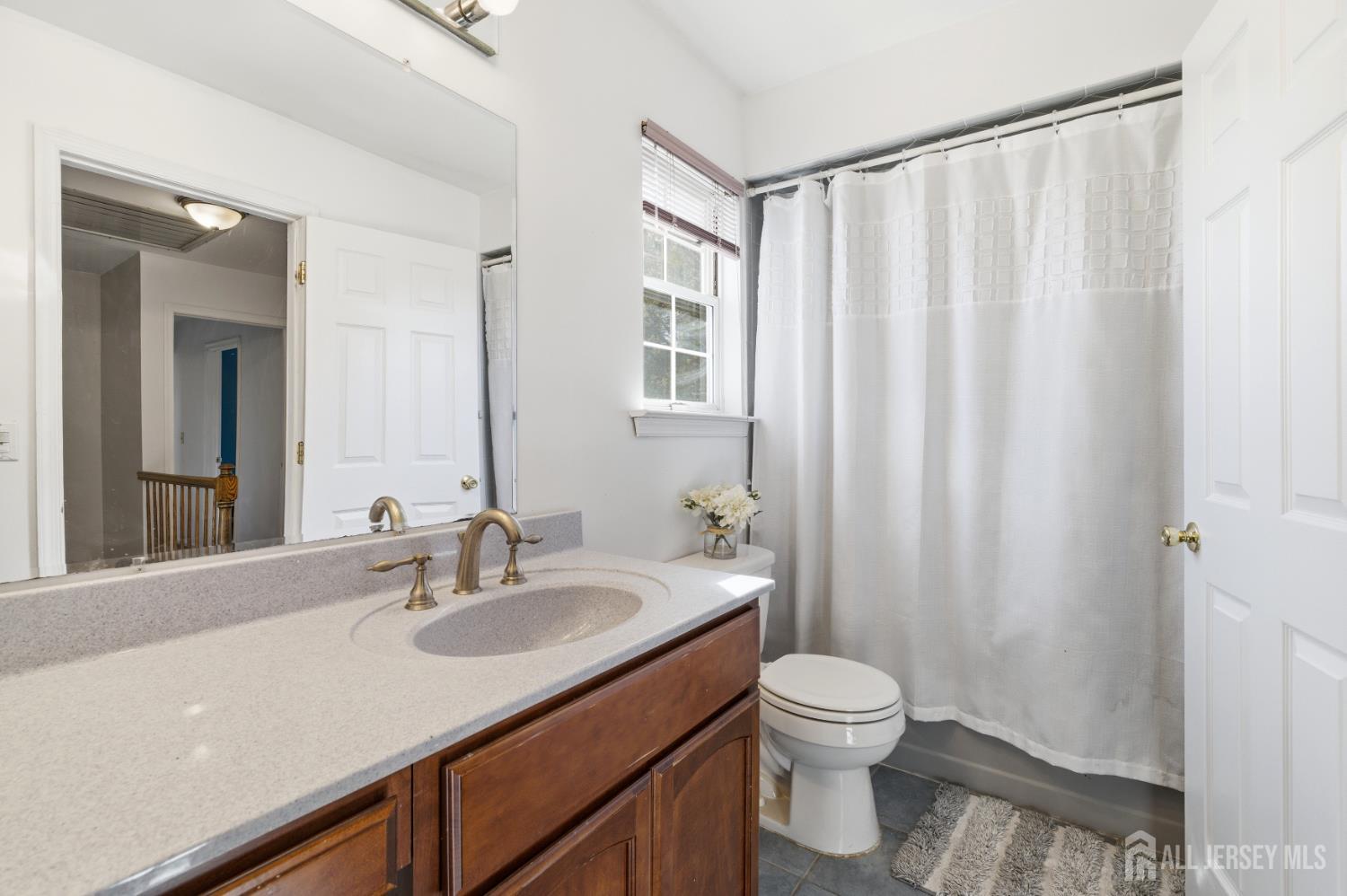 6 Shoshoni Way Somerville, NJ 08876 - Photo 26 of 52 a bathroom with a double vanity sink toilet and a mirror