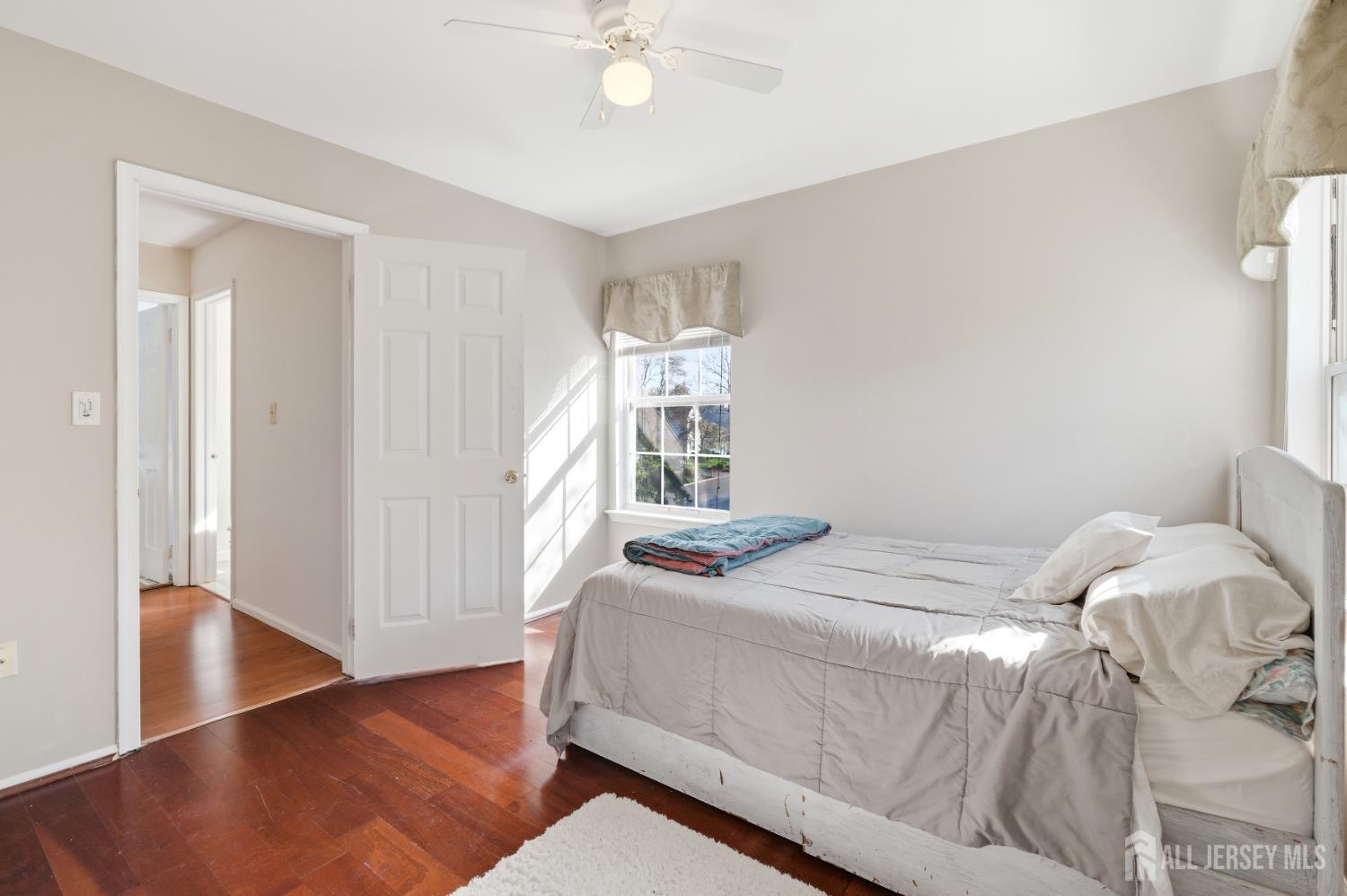 6 Shoshoni Way Somerville, NJ 08876 - Photo 27 of 52 a bedroom with a bed and wooden floor