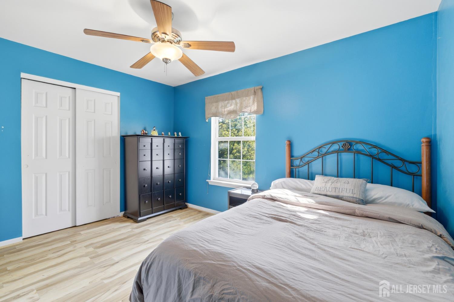 6 Shoshoni Way Somerville, NJ 08876 - Photo 30 of 52 a bedroom with a bed and a chandelier