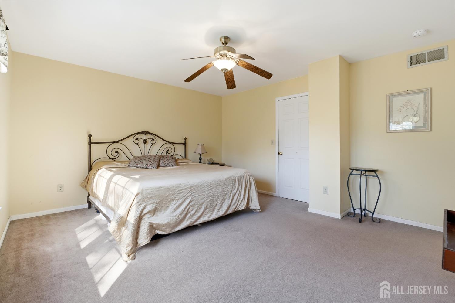 6 Shoshoni Way Somerville, NJ 08876 - Photo 31 of 52 a bedroom with a bed and a chandelier