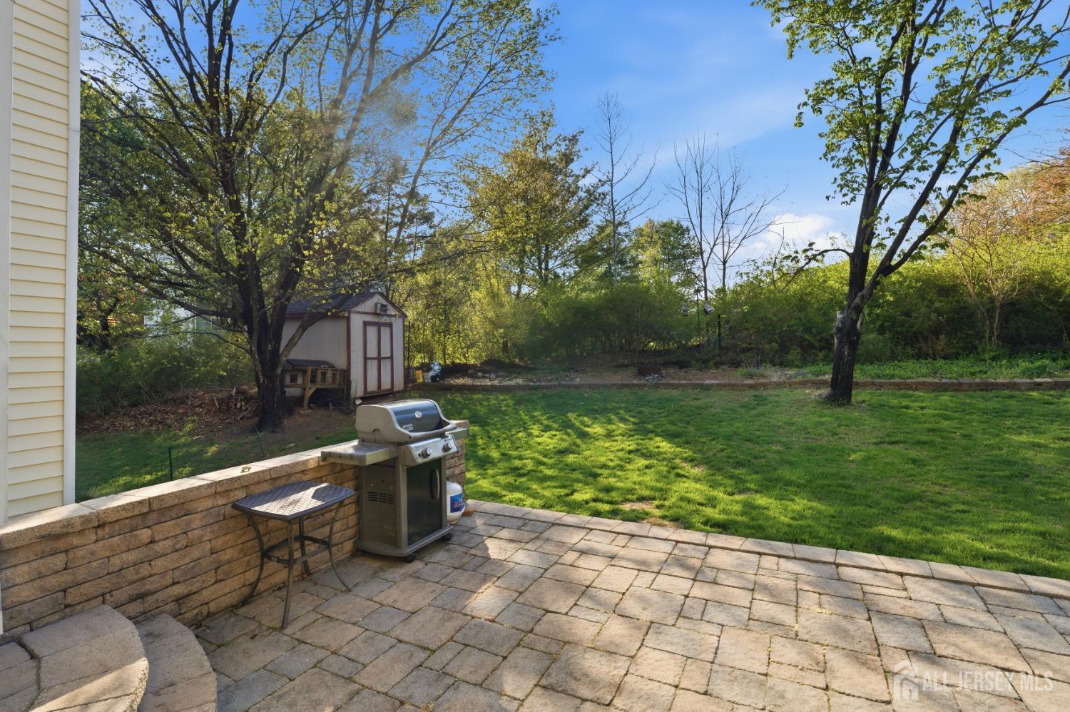 6 Shoshoni Way Somerville, NJ 08876 - Photo 40 of 52 a view of a patio with a table and chairs next to a yard