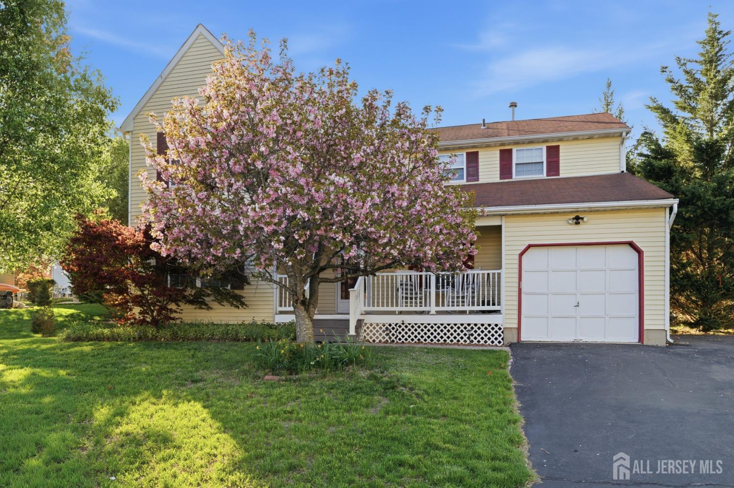 6 Shoshoni Way Somerville, NJ 08876 - Photo 4 of 52 a front view of a house with a garden