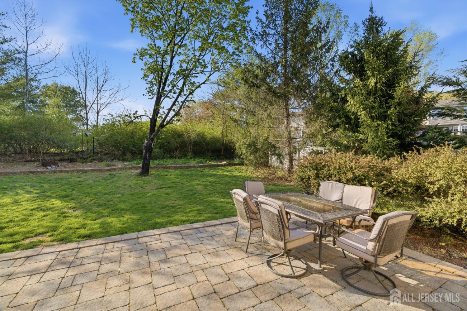 6 Shoshoni Way Somerville, NJ 08876 - Photo 41 of 52 a view of a chairs and table in backyard of the house