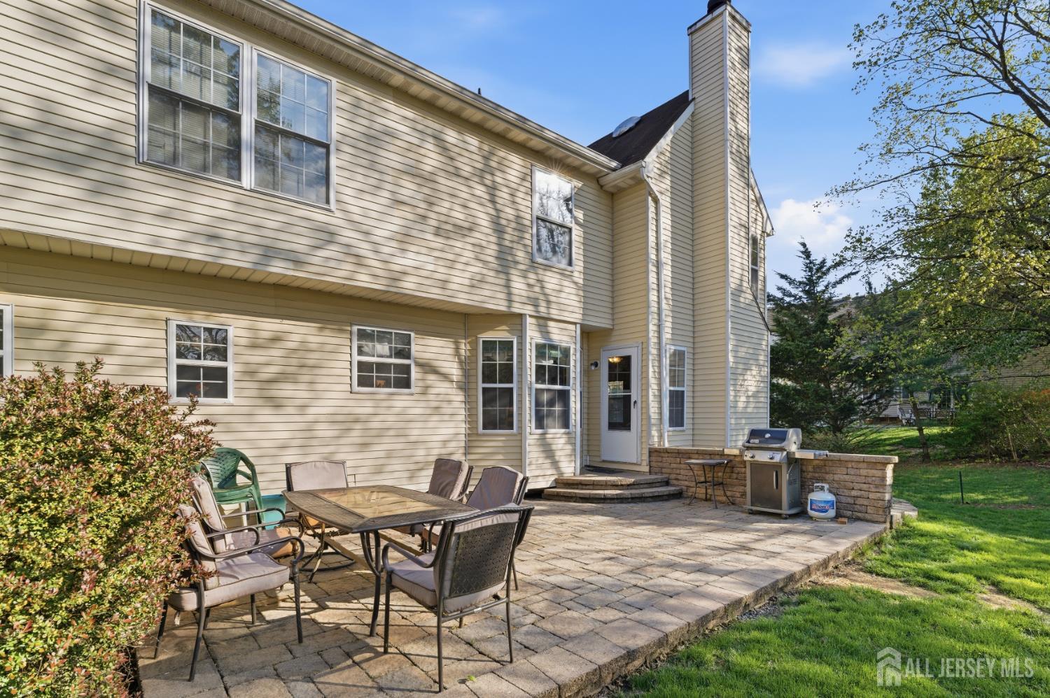 6 Shoshoni Way Somerville, NJ 08876 - Photo 43 of 52 a view of backyard with a table and chairs and potted plants