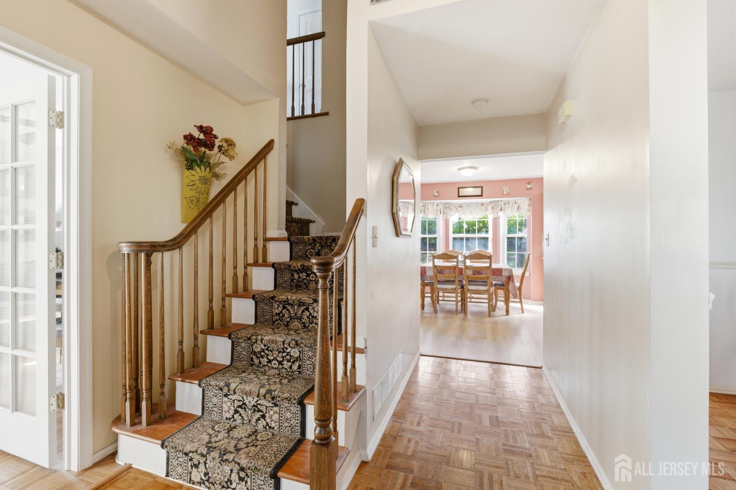 6 Shoshoni Way Somerville, NJ 08876 - Photo 9 of 52 a view of a hallway with wooden floor and stairs