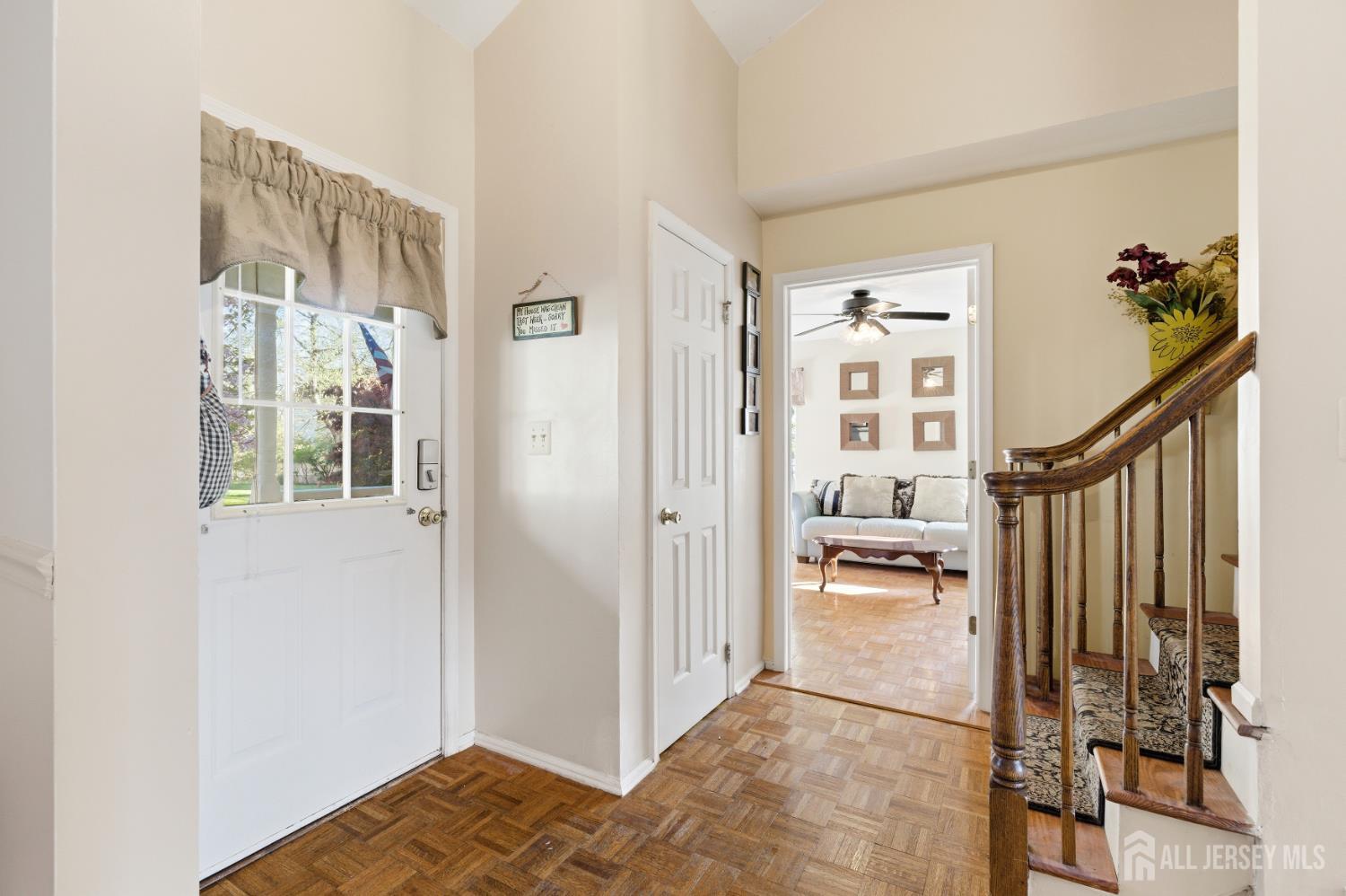 6 Shoshoni Way Somerville, NJ 08876 - Photo 10 of 52 a view of a hallway view with living room and wooden floor