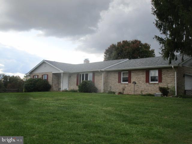 1746 Hopewell Road Port Deposit, MD 21904 - Photo 1 of 24 a front view of a house with a yard and trees