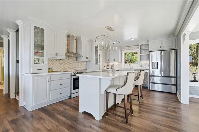 a living room with fireplace furniture and a flat screen tv