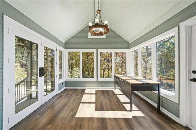 a bathroom with a shower sink vanity and mirror