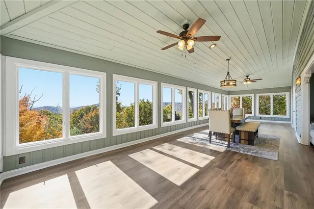 a bed room with a bed and a chandelier