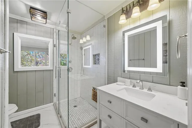 a view of a room with wooden floor and windows