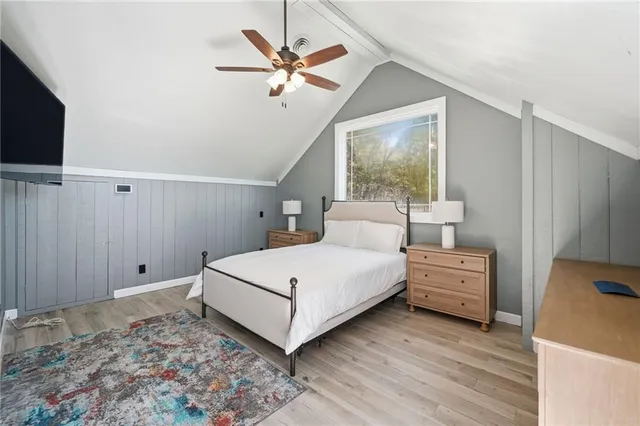 a bathroom with a double vanity sink a toilet and a shower