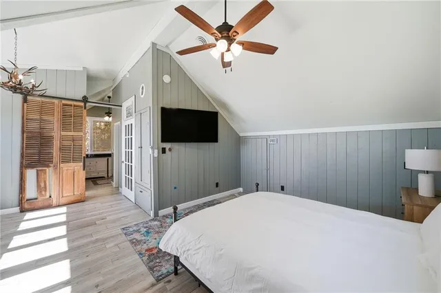 a bathroom with a double vanity sink toilet and shower