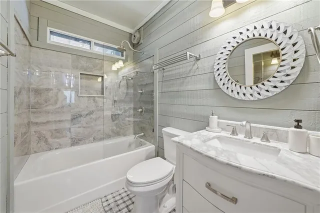 a view of a balcony with furniture and wooden floor