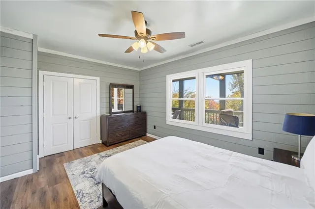 a view of a large house with a yard and large tree