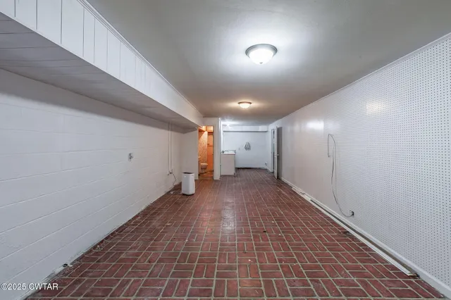 a bathroom with a toilet sink and shower