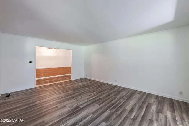 a view of an empty room and window