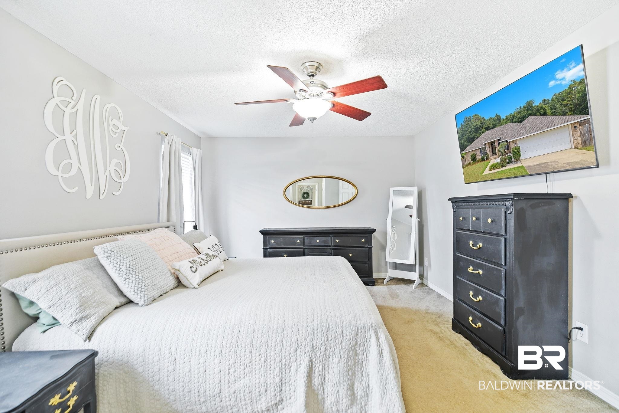 28246 Turkey Branch Drive Daphne, AL 36526 - Photo 16 of 41 Bedroom with ceiling fan, a textured ceiling, and light colored carpet
