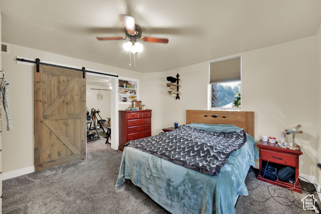 1632 South Main Street Springville, UT 84663 - Photo 9 of 93 Bedroom featuring a barn door, carpet floors, a spacious closet, and ceiling fan